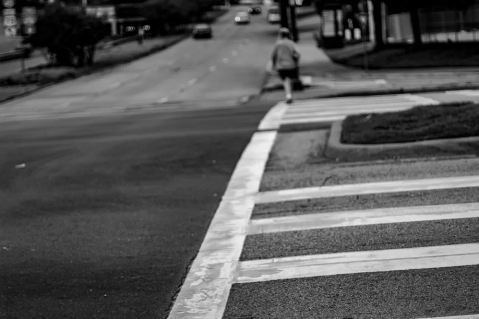 Black and white photo of crosswalk